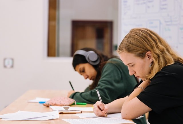 Students Writing Down on Paper | Spyglass Realty